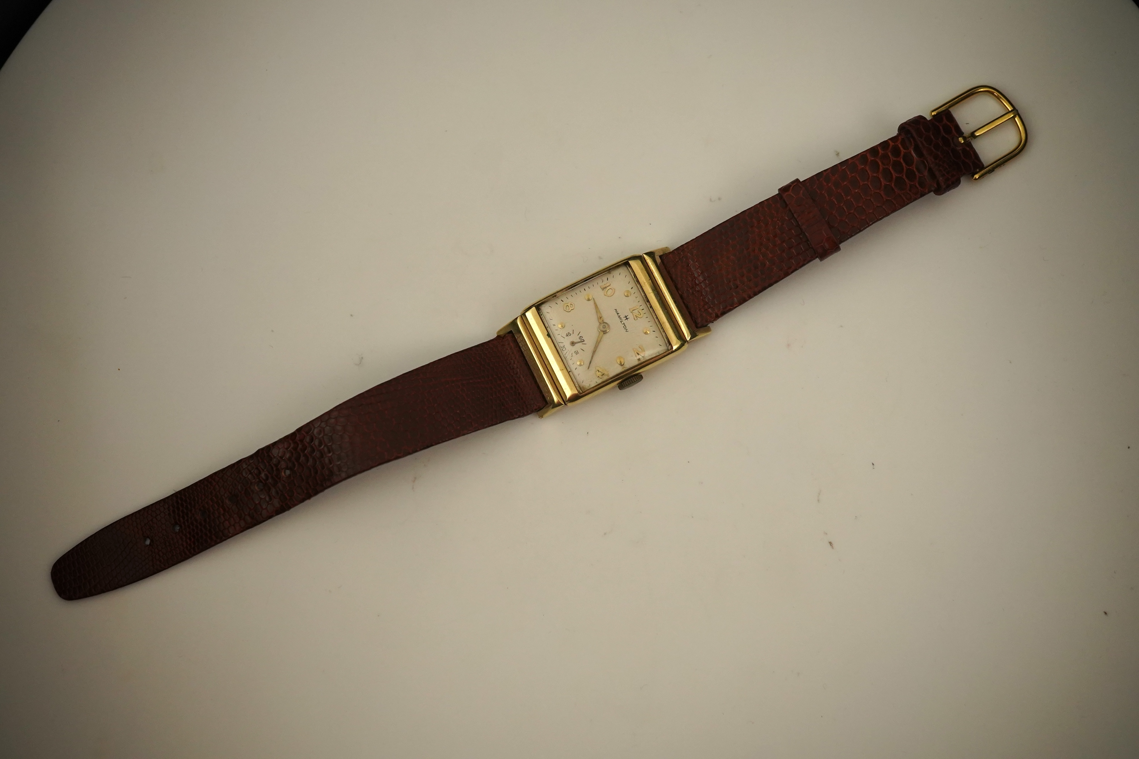 A gentleman's 1950's? 14k gold Hamilton manual wind wrist watch, on a later associated leather strap